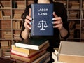 LABOR LAWS book`s name. CollectiveÃÂ labour lawÃÂ relates to the tripartite relationship between employee, employer and union Royalty Free Stock Photo